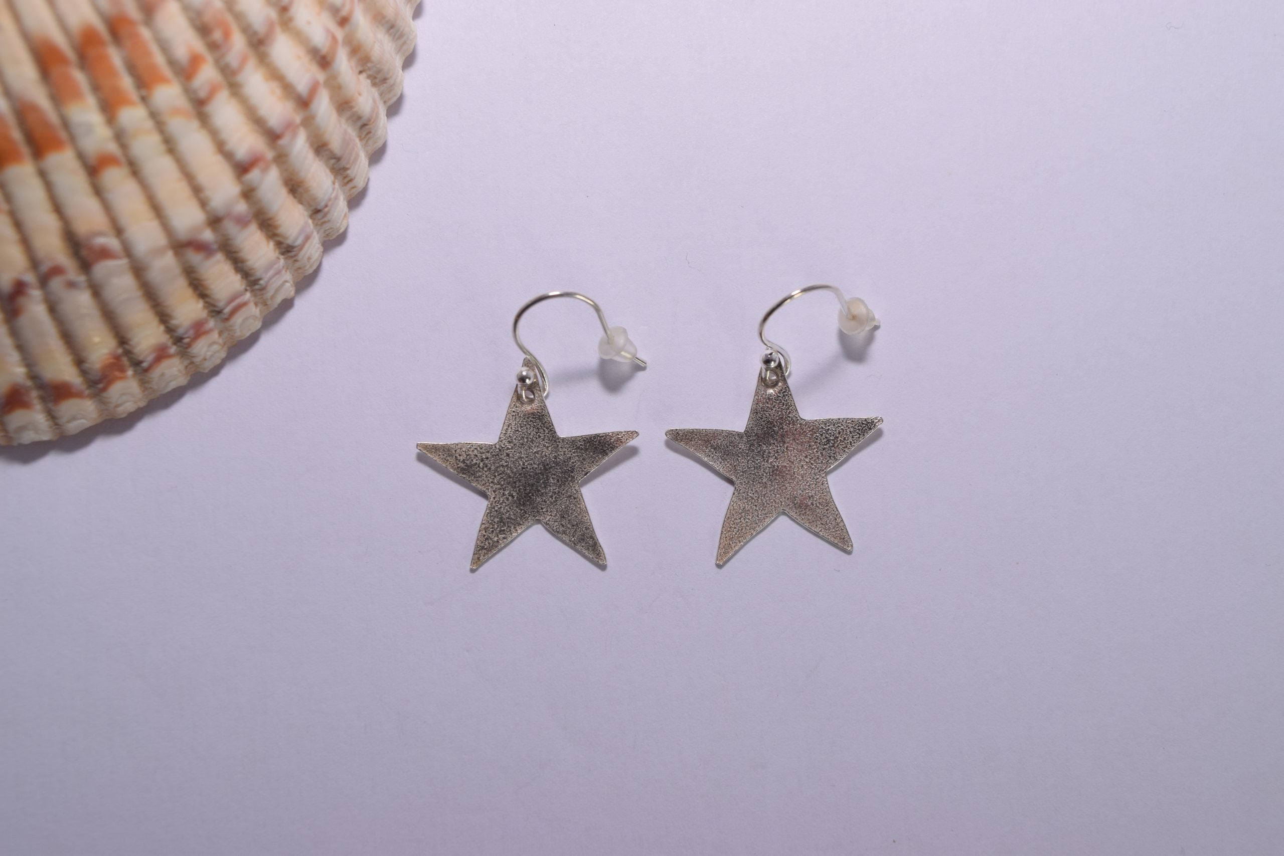 EA79. Reticulated silver star earrings