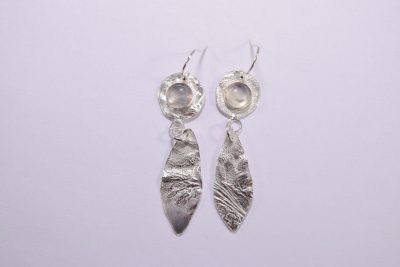 EA44. Reticulated silver circle and leaf drop earrings with moonstone