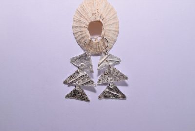 EA58. Three silver reticulated triangle drop earrings