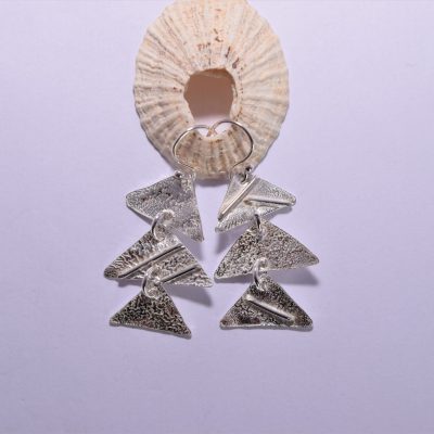 EA58. Three silver reticulated triangle drop earrings
