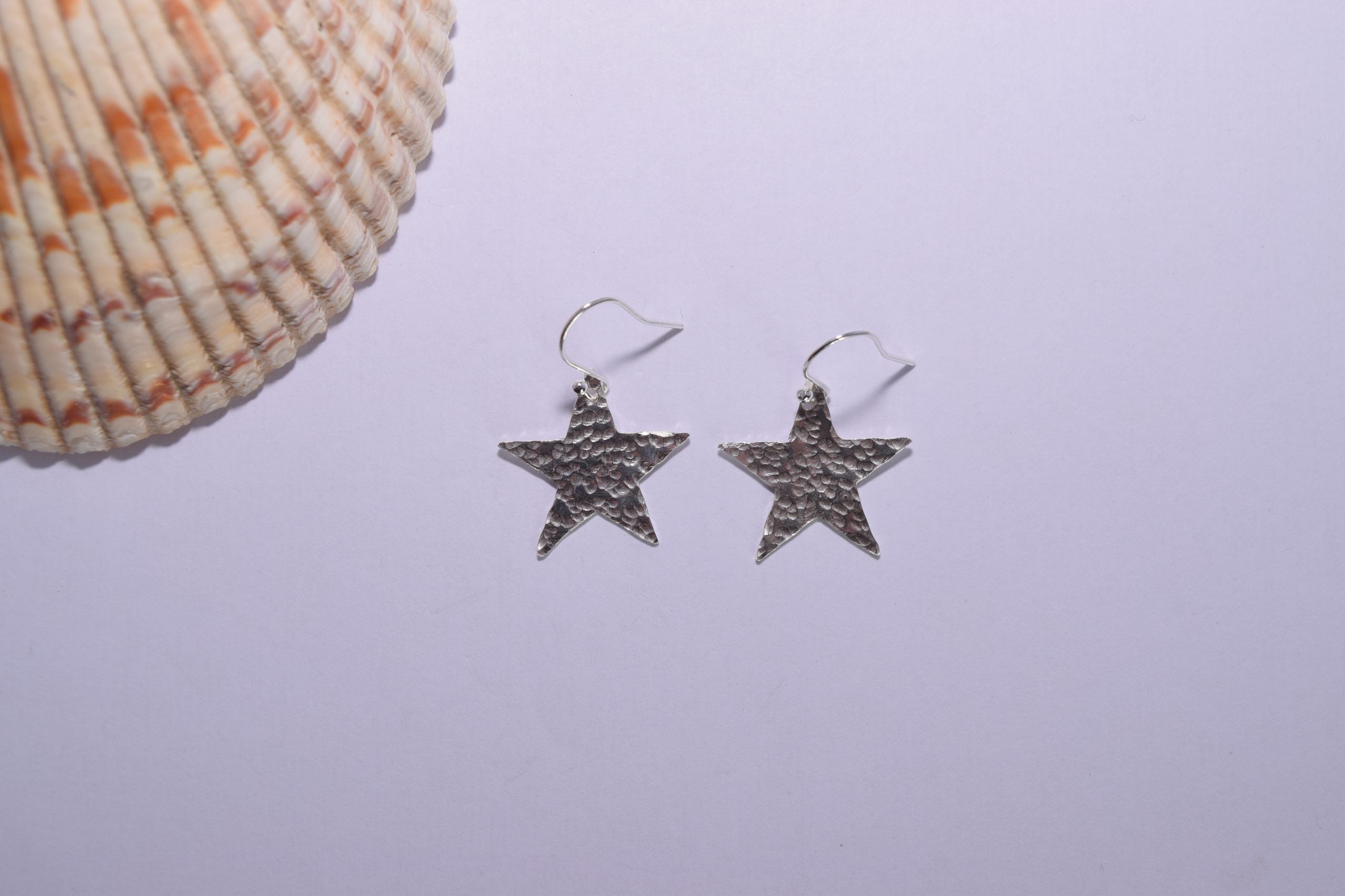 EA75. Hammered silver star earrings