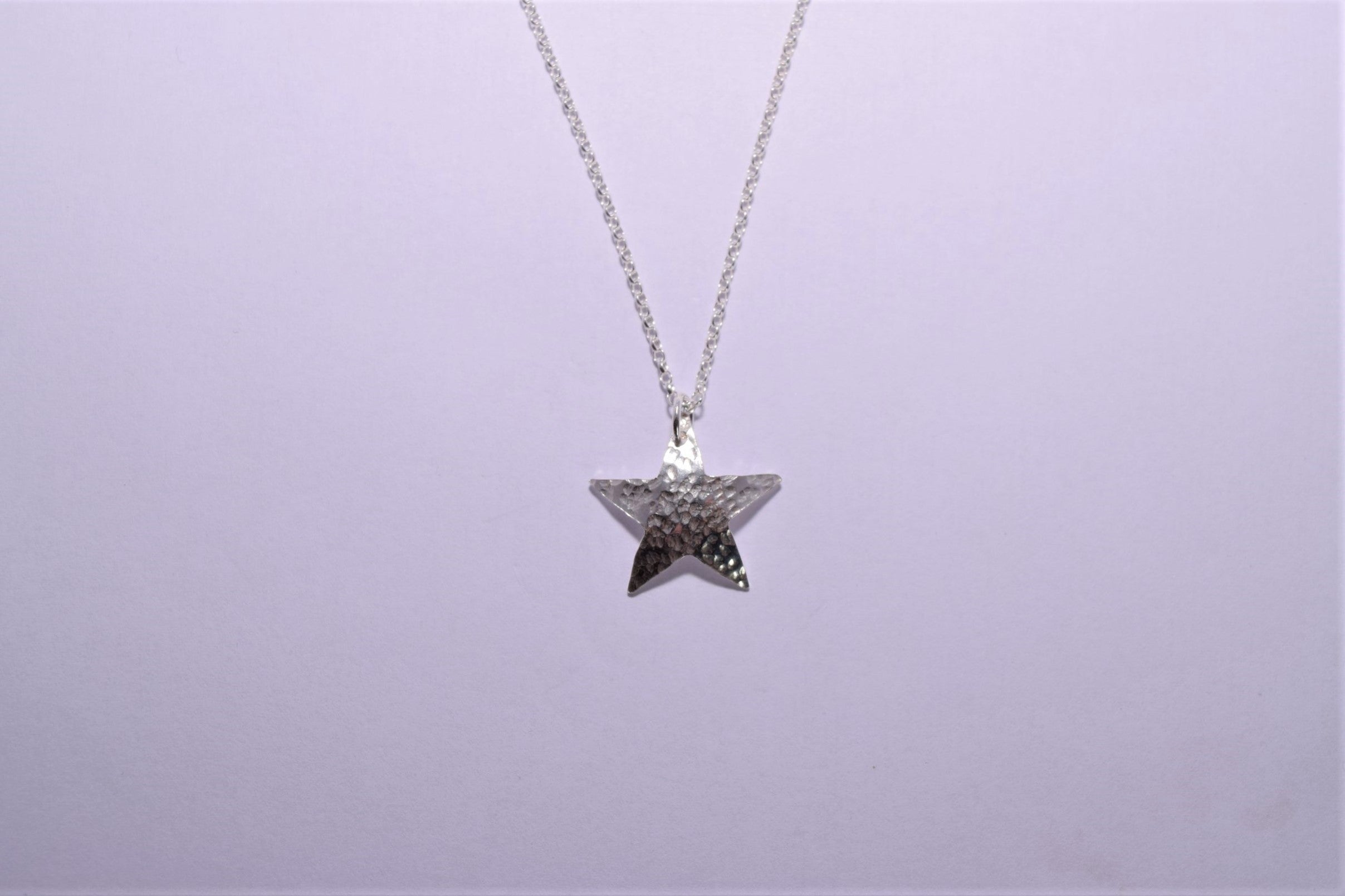 NP35. Hammered silver star pendant