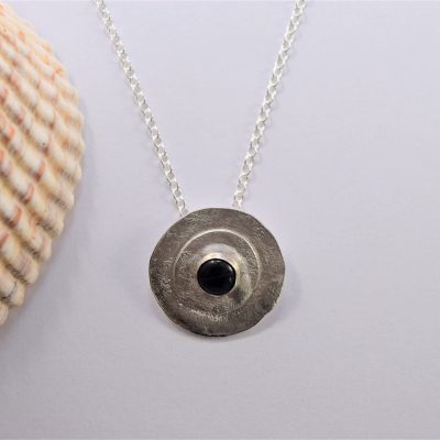 NP41. Silver reticulated layered circles with black Onyx stone