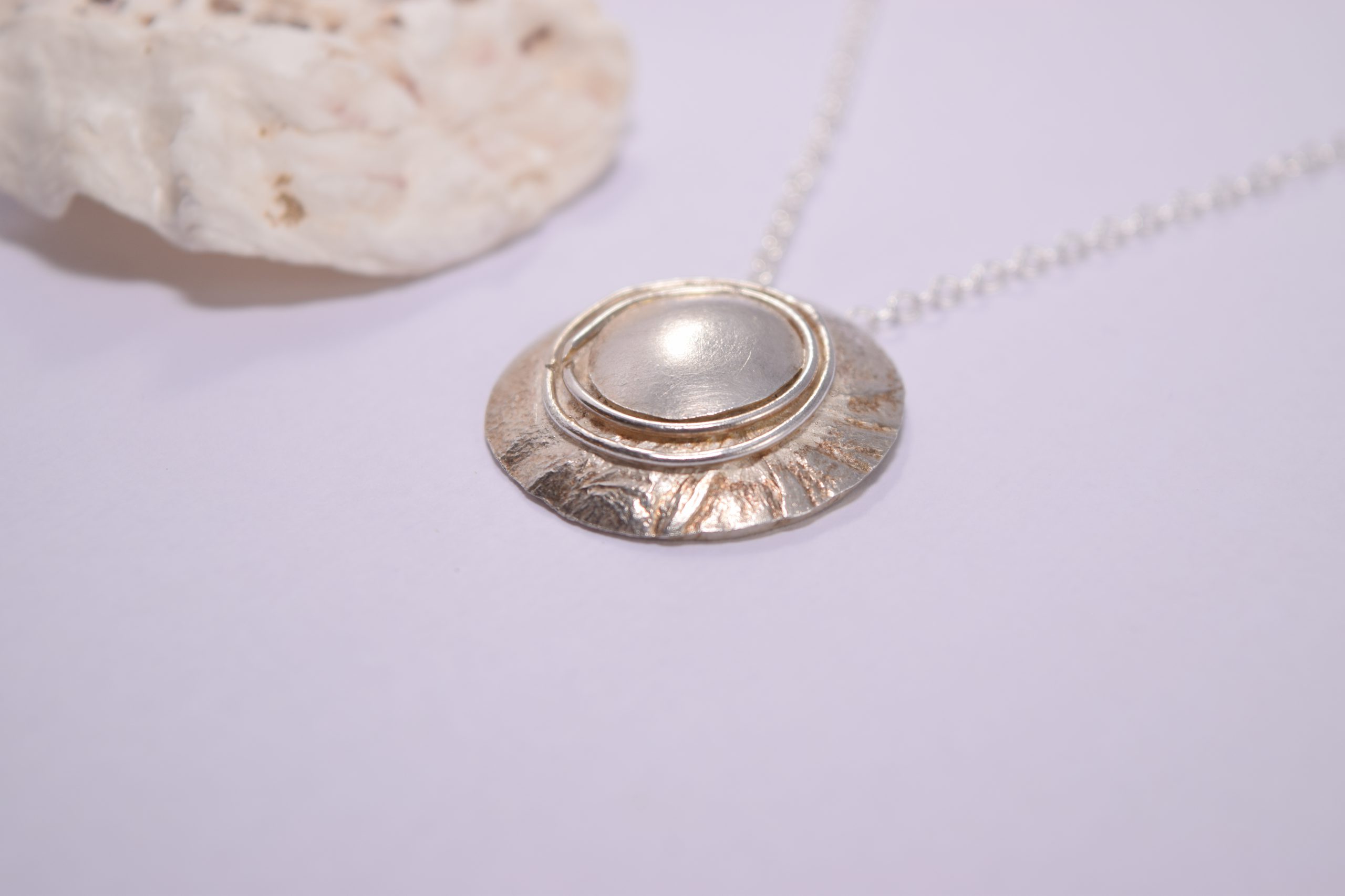 NP43. Layered silver disks with silver wire detail pendant - Image 2