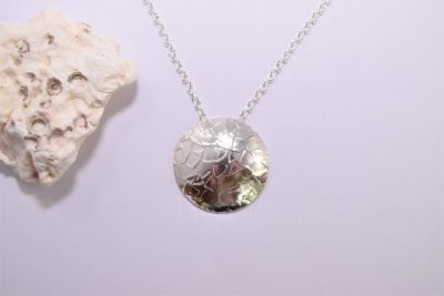 NP45. Textured silver disc pendant
