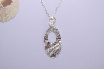 NP14. Cut out silver reticulated oval pendant with wire detail