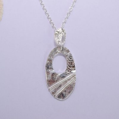 NP14. Cut out silver reticulated oval pendant with wire detail