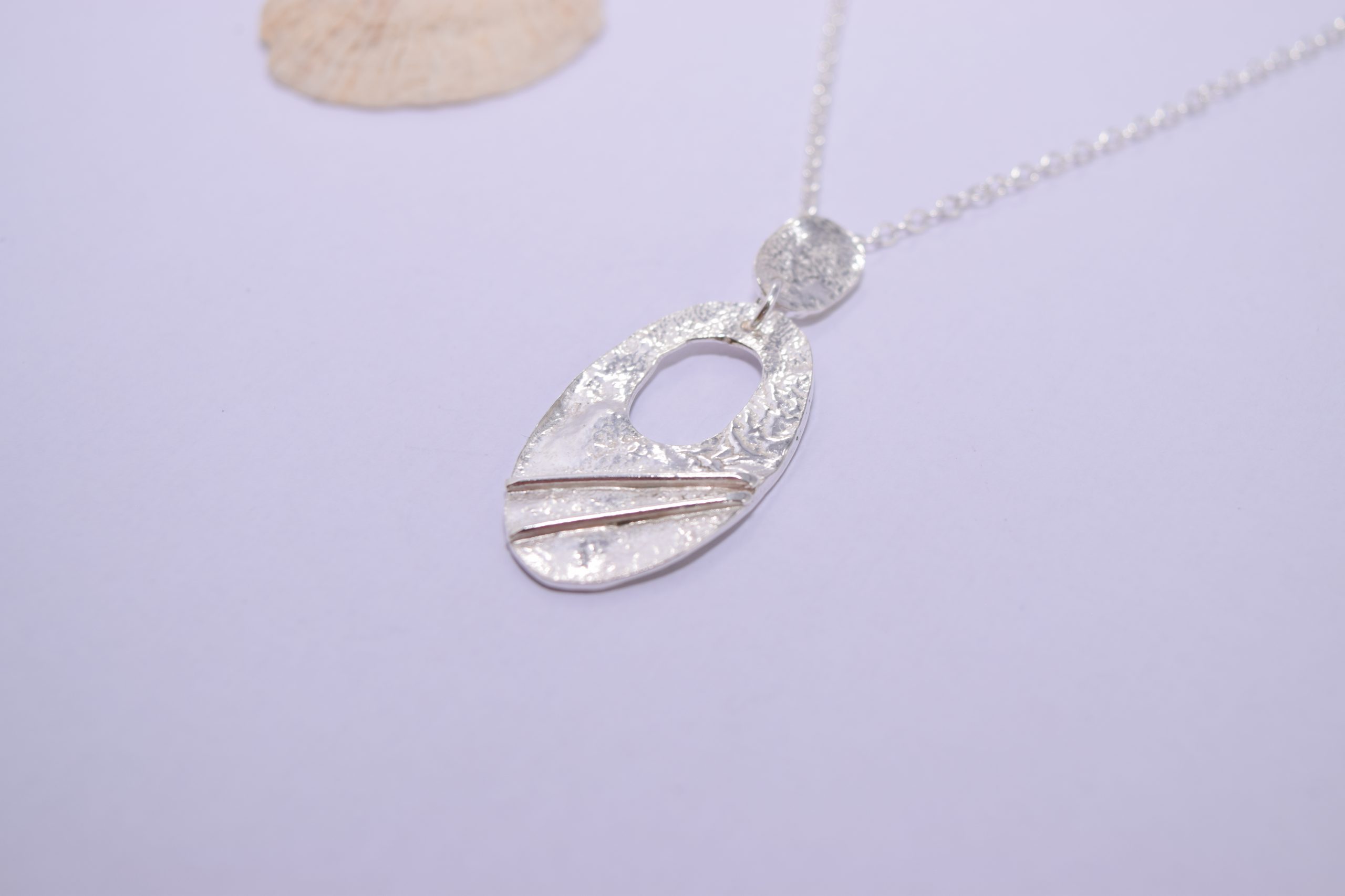 NP14. Cut out silver reticulated oval pendant with wire detail - Image 2