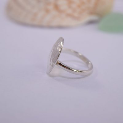 R05. Hammered silver circular domed ring