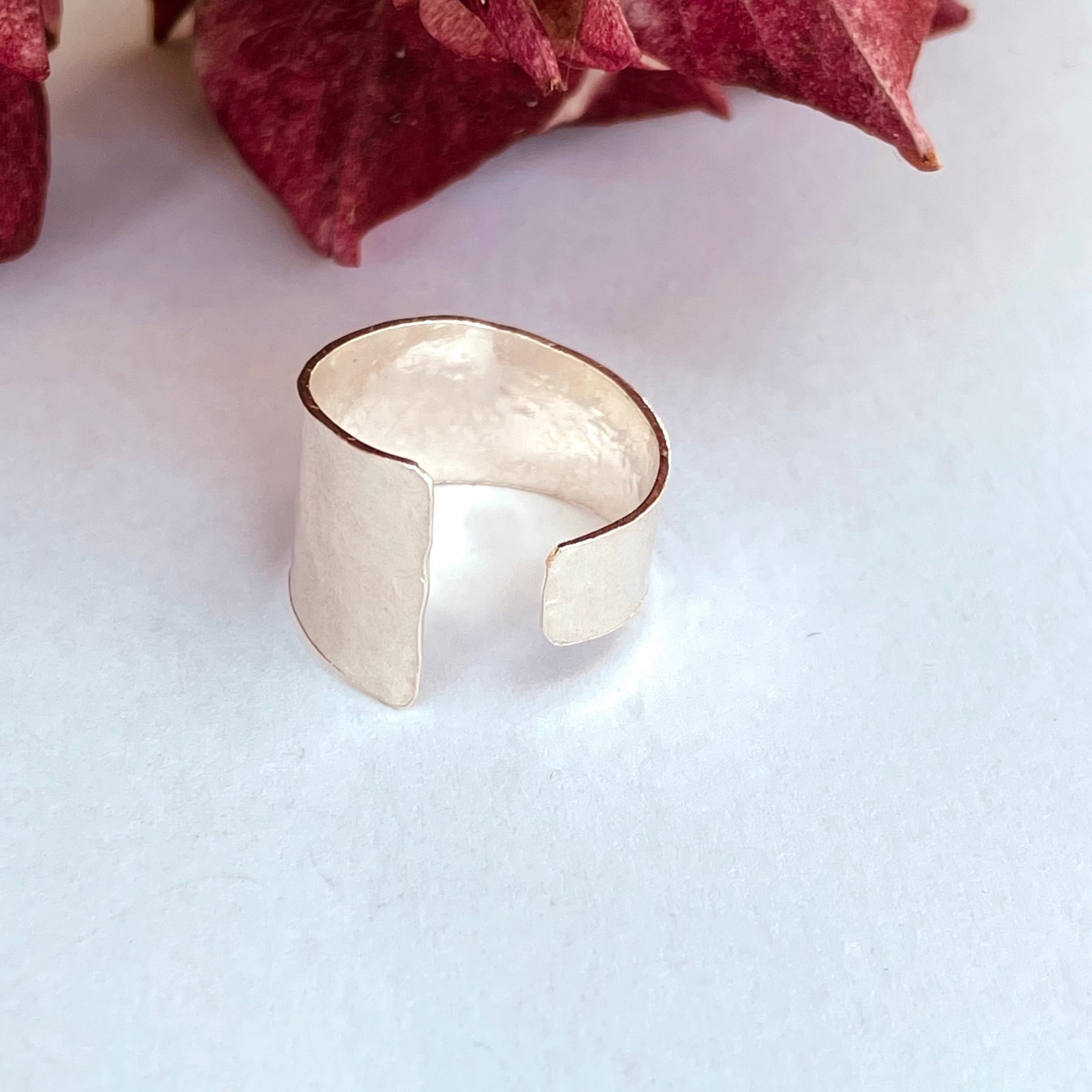 R01. An open hammered ring.