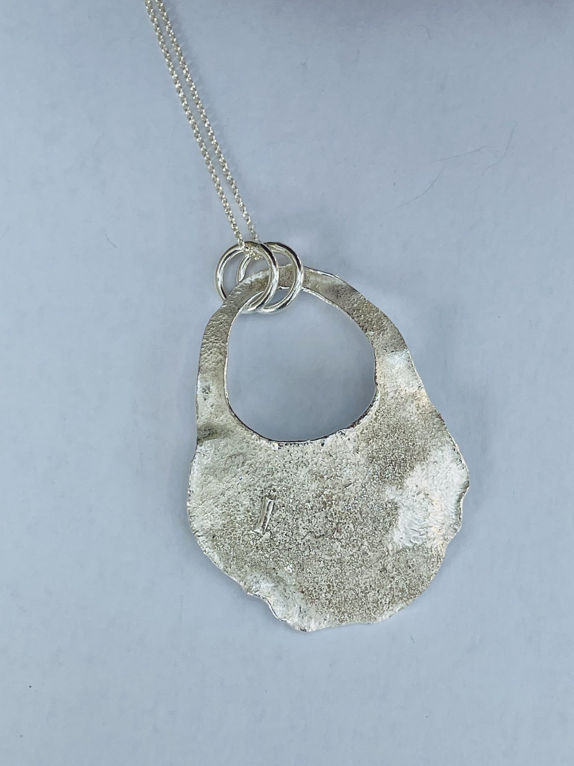 NP04. Reticulated abstract oval pendant with cut out detail - Image 2