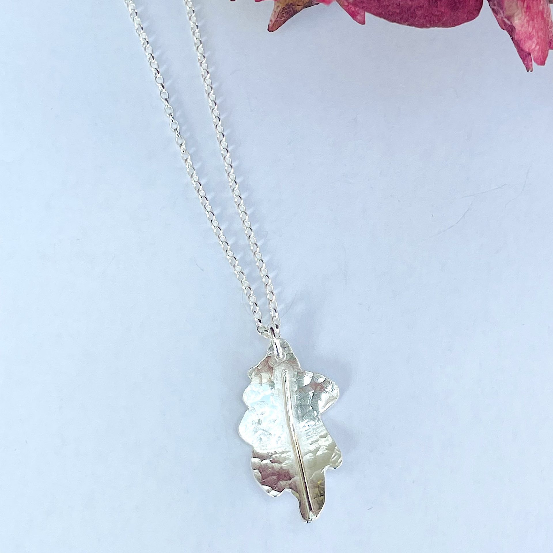 NP03. Lovely hammered oak leaf pendant with silver wire detail